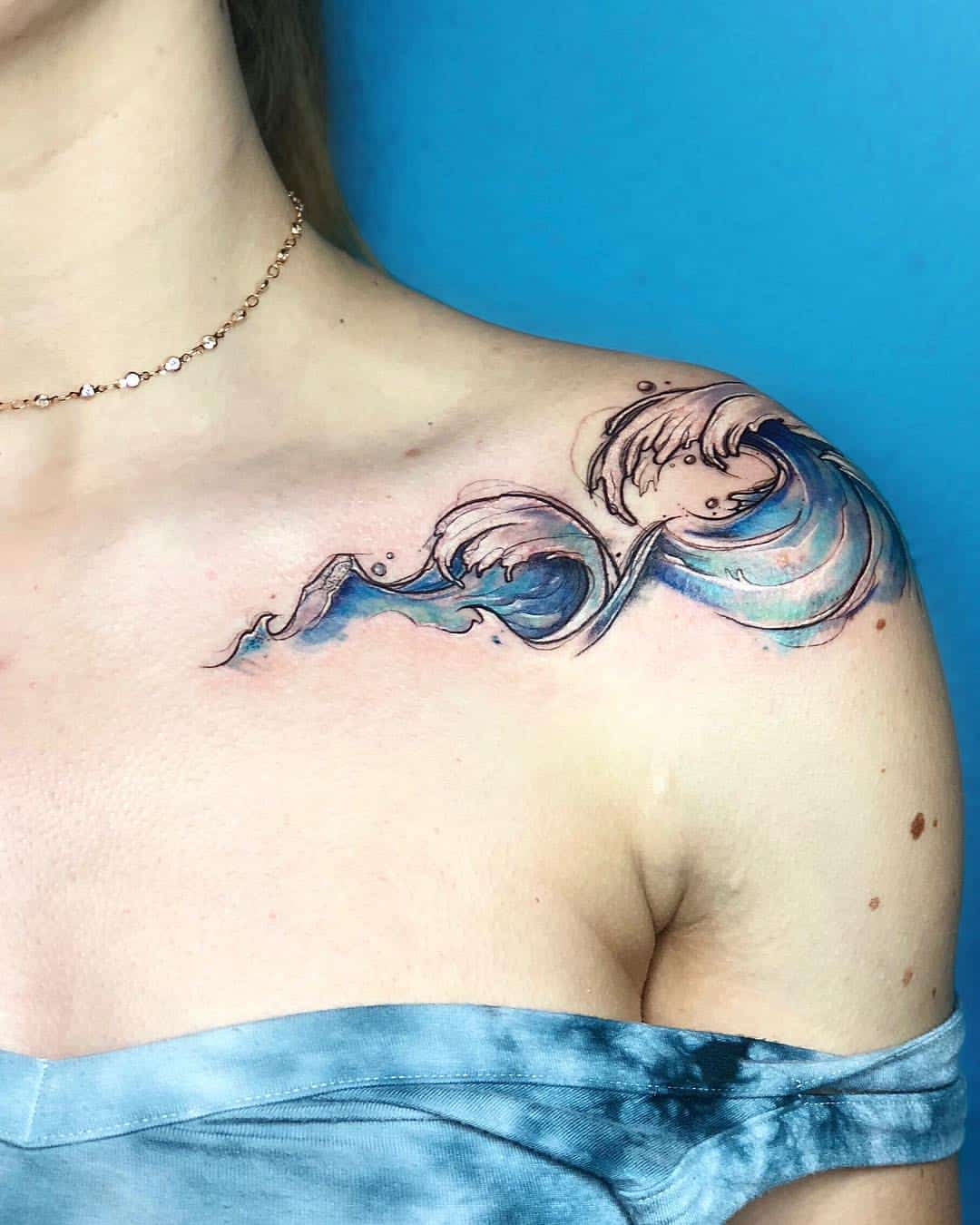 Blue Waves Tattooed on Collarbone